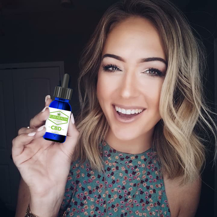 girl holding Pure Heath CBD bottle